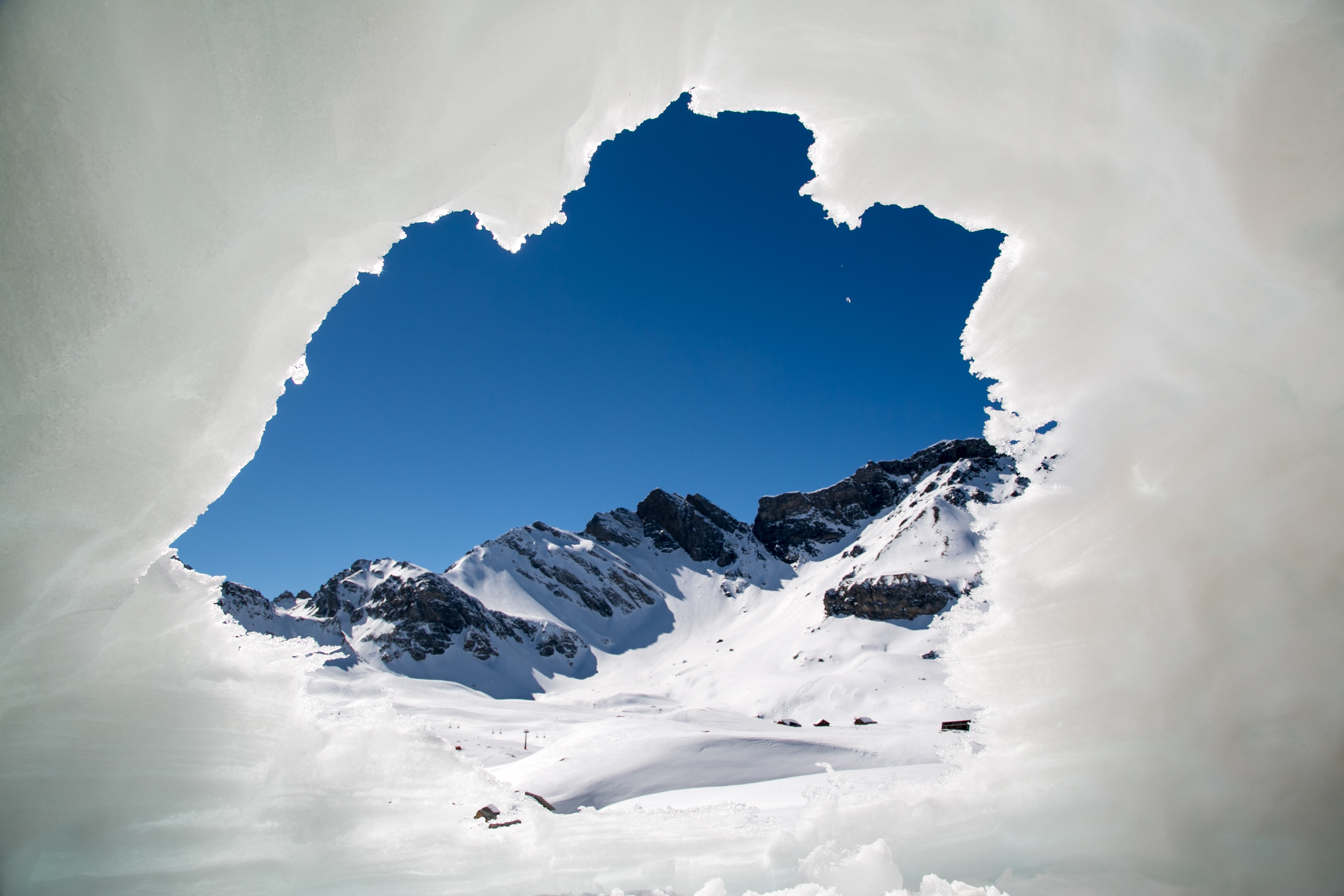 Looking through the opening of and ice hole in the  Switzerland Alps by rivella