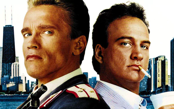 High-definition wallpaper featuring Arnold Schwarzenegger and James Belushi from the movie Red Heat, set against a city skyline backdrop.
