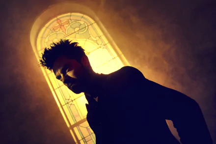 Moody silhouette of a TV preacher against a glowing stained-glass window — cinematic Preacher TV series vibe, 4K Ultra HD PC desktop wallpaper.