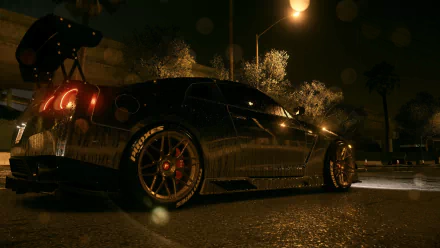 A sleek Nissan GT-R parked under streetlights in a nighttime setting, featured prominently in the video game Need For Speed (2015). An HD desktop wallpaper capturing high-octane energy.