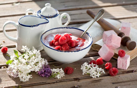 4K Ultra HD still life of fresh raspberries and yogurt in a rustic bowl, accompanied by white flowers, sugar cubes, and vintage ceramic pitchers on a wooden surface.
