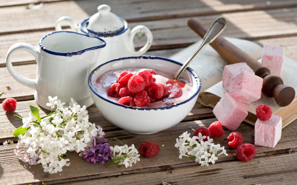 4K Ultra HD still life of fresh raspberries and yogurt in a rustic bowl, accompanied by white flowers, sugar cubes, and vintage ceramic pitchers on a wooden surface.