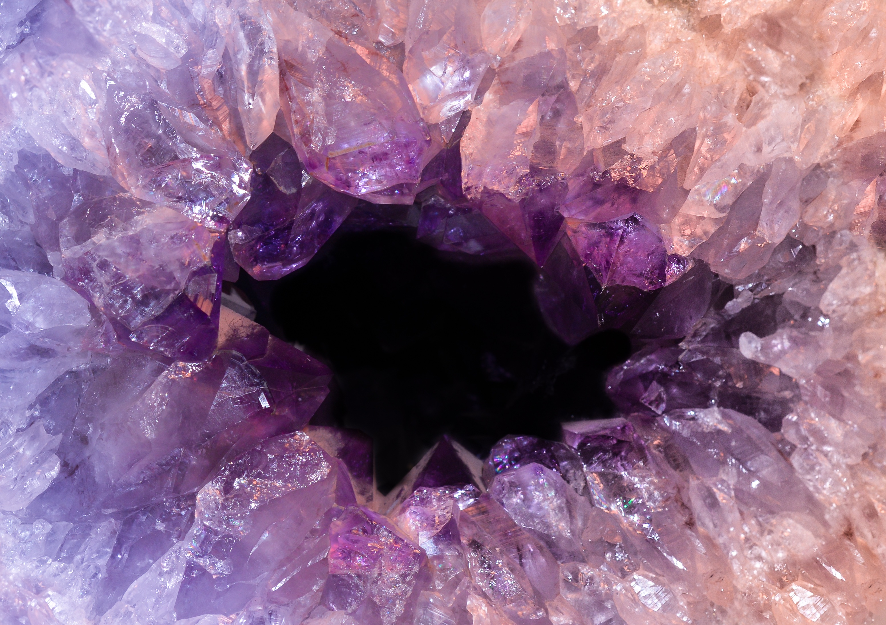 Amethyst is a violet variety of quartz often used in jewelry. by Skitterphoto