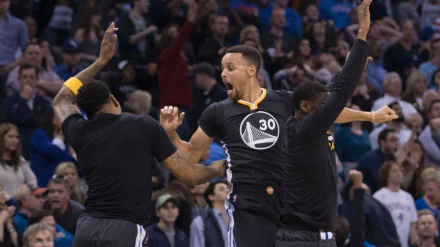 A dynamic moment featuring Golden State Warriors players celebrating a victory, captured in high definition for an engaging sports-themed desktop wallpaper.