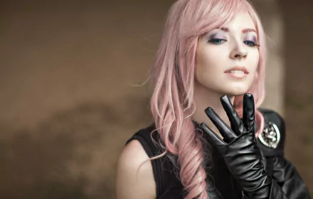 A woman cosplays as Lightning from Final Fantasy, featuring striking pink hair and a stylish black outfit, creating a captivating HD desktop wallpaper background.