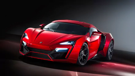 A striking red Lykan HyperSport showcased in an HD desktop wallpaper, emphasizing its aerodynamic design and sleek lines against a dramatic background.