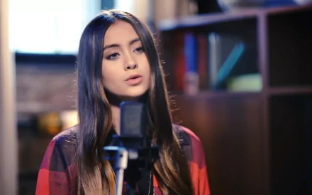 HD PC desktop wallpaper of Jasmine Thompson singing into a microphone in a music studio setting.
