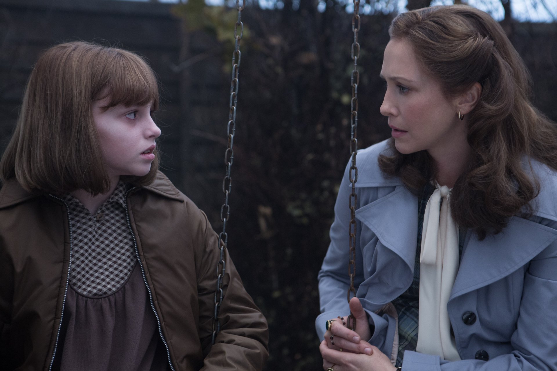 A HD desktop wallpaper featuring Sterling Jerins and Vera Farmiga in a scene from the movie The Conjuring 2.