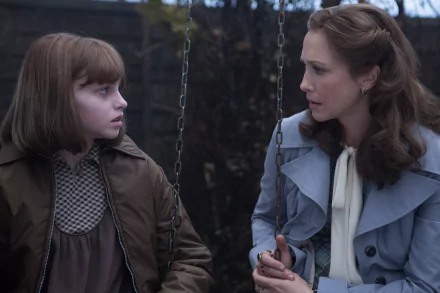 A HD desktop wallpaper featuring Sterling Jerins and Vera Farmiga in a scene from the movie The Conjuring 2.