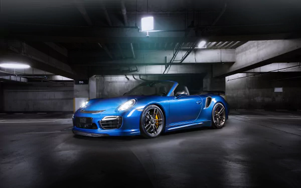 A blue Porsche 911 Turbo sports car parked in a dimly lit underground garage, captured in HD for a striking desktop wallpaper and background.