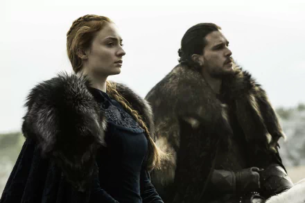 Jon Snow and Sansa Stark, portrayed by Kit Harington and Sophie Turner, stand together in this dramatic HD wallpaper from Game of Thrones, dressed in fur cloaks against a misty backdrop.