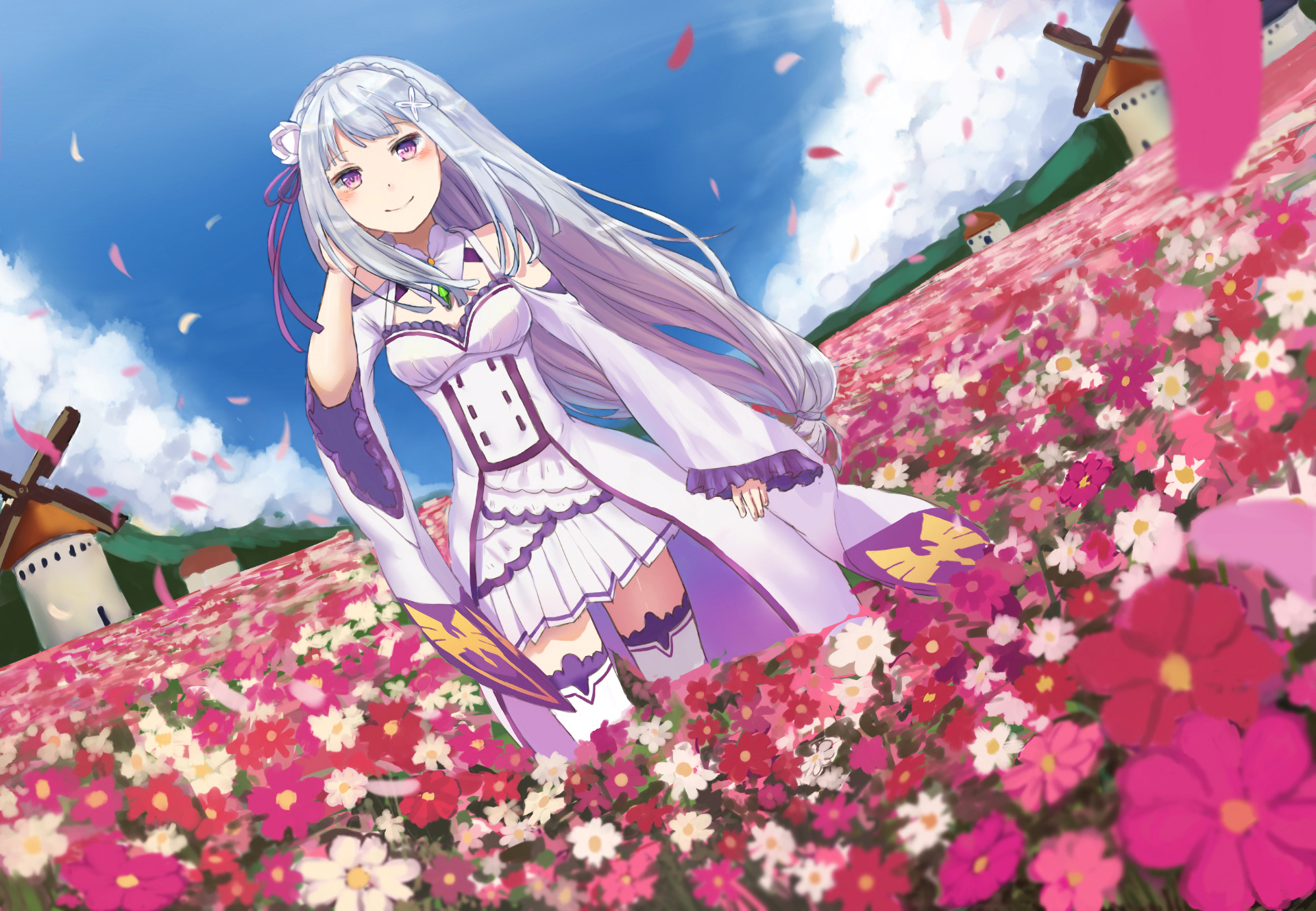 Emilia stands gracefully in a vibrant field of flowers, surrounded by windmills under a bright blue sky. This HD wallpaper captures a serene moment from Re:Zero - Starting Life in Another World.