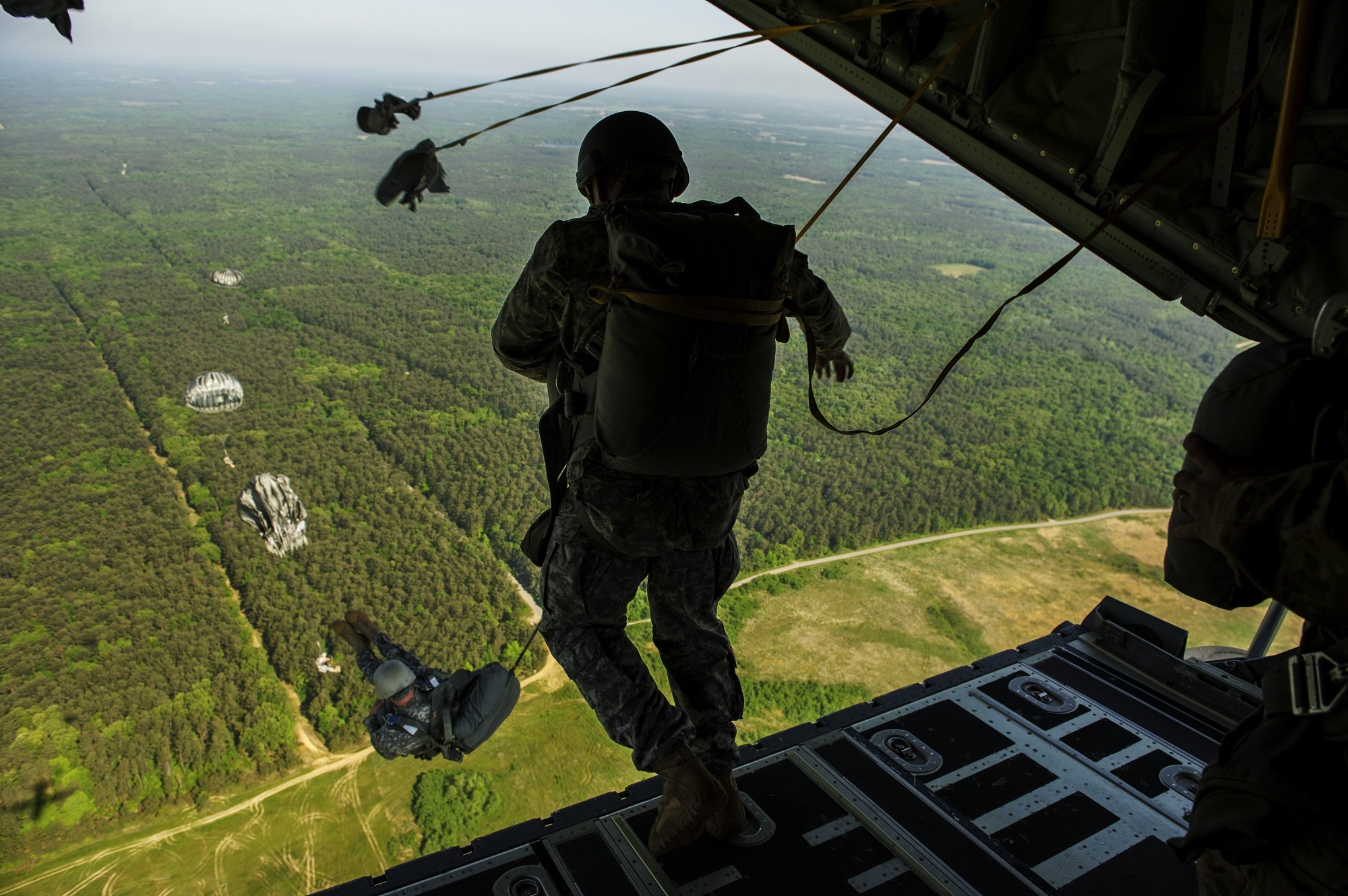 Soldiers free fall parachuting from a aircraft by skeeze