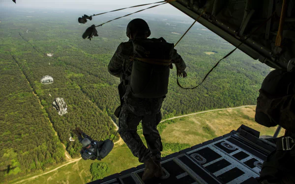  Soldiers free fall parachuting from a aircraft by skeeze