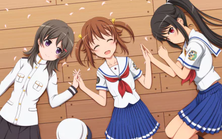 Three anime characters, Moeka China, Mashiro Munetani, and Akeno Misaki from High School Fleet, are playfully lying on a wooden floor, surrounded by falling petals in vibrant 4K Ultra HD.