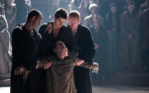 HD desktop wallpaper featuring Finn Jones as Loras Tyrell in a dramatic scene from the TV show Game of Thrones.