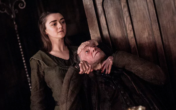HD desktop wallpaper of Maisie Williams as Arya Stark from the TV show Game of Thrones, showcasing a dramatic scene with her holding a man by the neck.