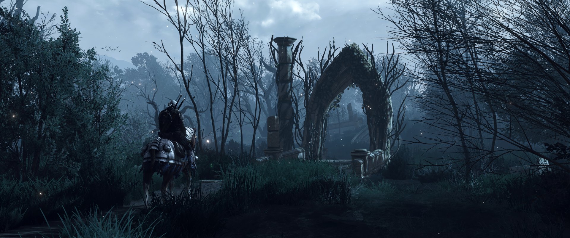 A moody HD wallpaper from The Witcher 3: Wild Hunt, featuring a solitary figure on horseback beside an ancient stone arch amidst misty trees and overgrown grass.