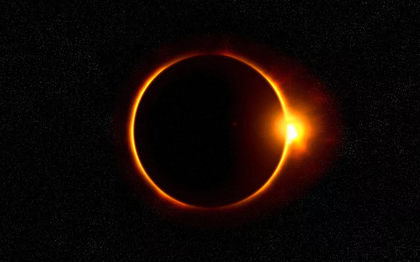 HD desktop wallpaper of a solar eclipse against a black, starry sky, showcasing nature’s celestial event with a glowing ring of light.