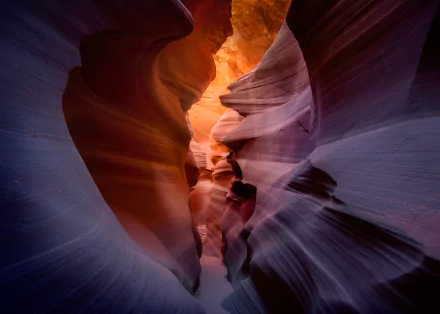 HD desktop wallpaper of Arizona’s Antelope Canyon showcasing smooth, flowing sandstone walls illuminated by warm sunlight in a stunning natural canyon landscape.
