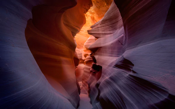 HD desktop wallpaper of Arizona’s Antelope Canyon showcasing smooth, flowing sandstone walls illuminated by warm sunlight in a stunning natural canyon landscape.
