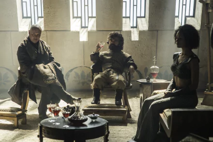 A scene from Game of Thrones featuring Tyrion Lannister and Lord Varys, with Missandei in an intimate setting, showcasing characters portrayed by Peter Dinklage, Conleth Hill, and Nathalie Emmanuel.