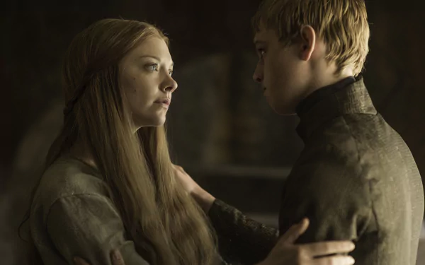 HD desktop wallpaper featuring Tommen Baratheon (Dean-Charles Chapman) and Margaery Tyrell (Natalie Dormer) from the TV show Game of Thrones in a dimly lit, intimate scene.