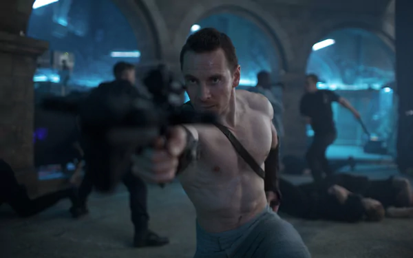 Michael Fassbender in a dramatic scene from the movie Assassin's Creed, aiming a weapon with intensity against a backdrop of action and chaos. HD desktop wallpaper.