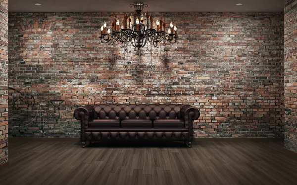 HD PC desktop wallpaper featuring a lounge room with a dark leather couch, exposed brick wall, wooden floor, and an ornate chandelier hanging from the ceiling.