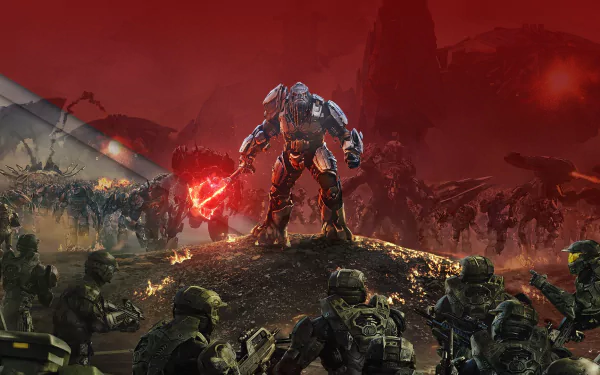 HD PC desktop wallpaper from the video game Halo Wars 2 depicting a fierce battle scene with armored soldiers facing a towering enemy wielding a red energy weapon.