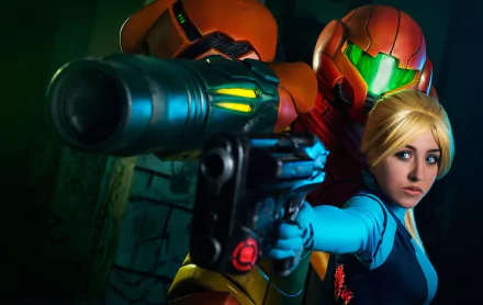 HD PC desktop wallpaper featuring a detailed Metroid cosplay of Samus Aran, with the character aiming a weapon and a woman in the iconic suit and blonde hair.