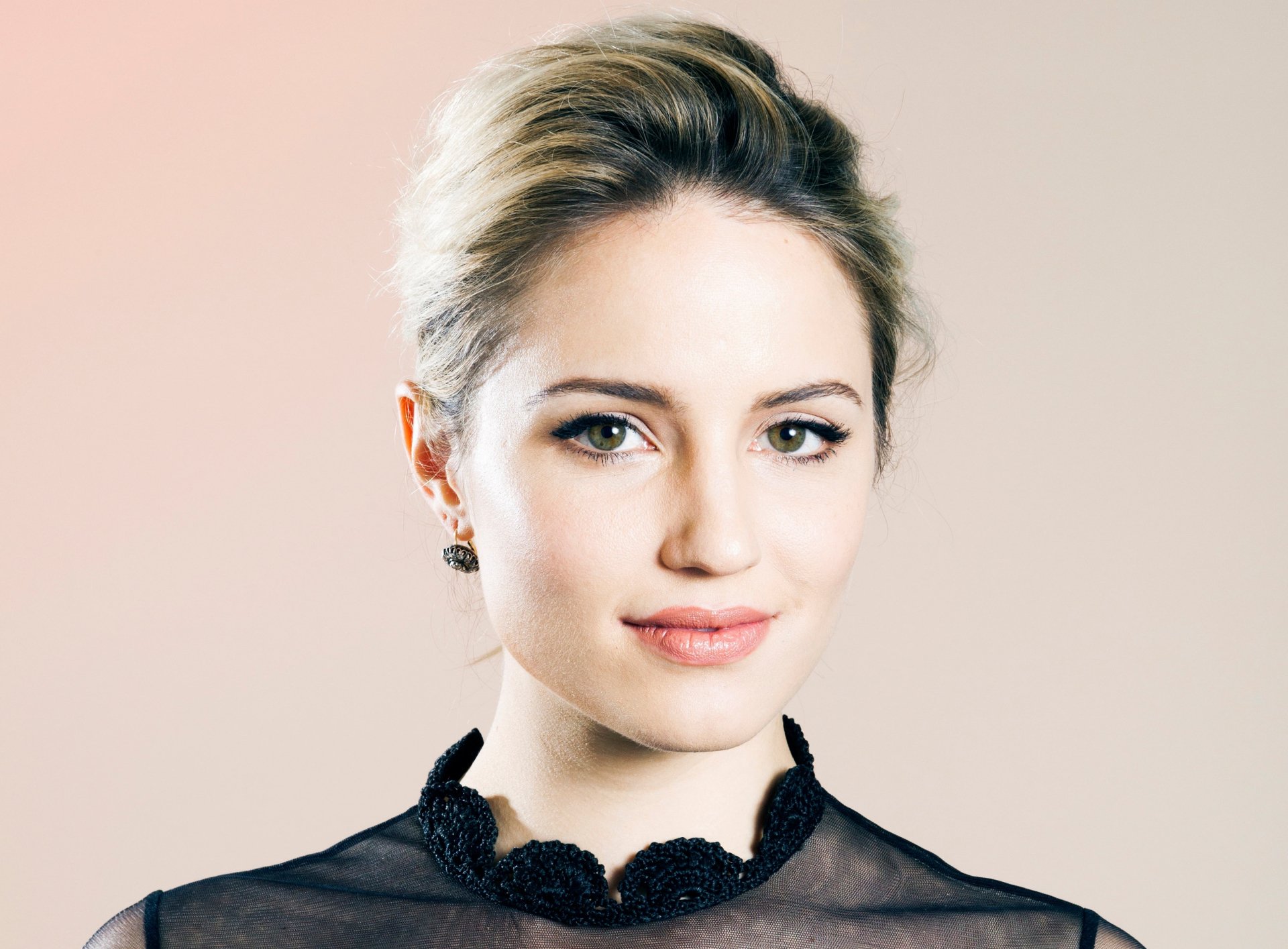 HD desktop wallpaper featuring a close-up of American actress Dianna Agron with green eyes against a soft, neutral background.