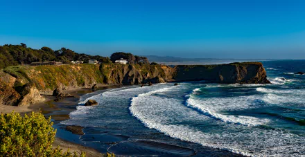 HD desktop wallpaper featuring scenic ocean waves crashing against the California coastline cliffs, showcasing the natural beauty of the USA seascape.