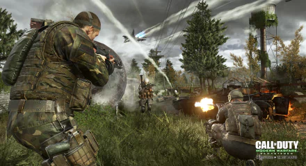 Video game Call Of Duty: Modern Warfare Remastered 2K Quad HD PC desktop wallpaper — soldiers trade fire in a grassy, tree-lined battlefield as aircraft and explosions streak the sky.