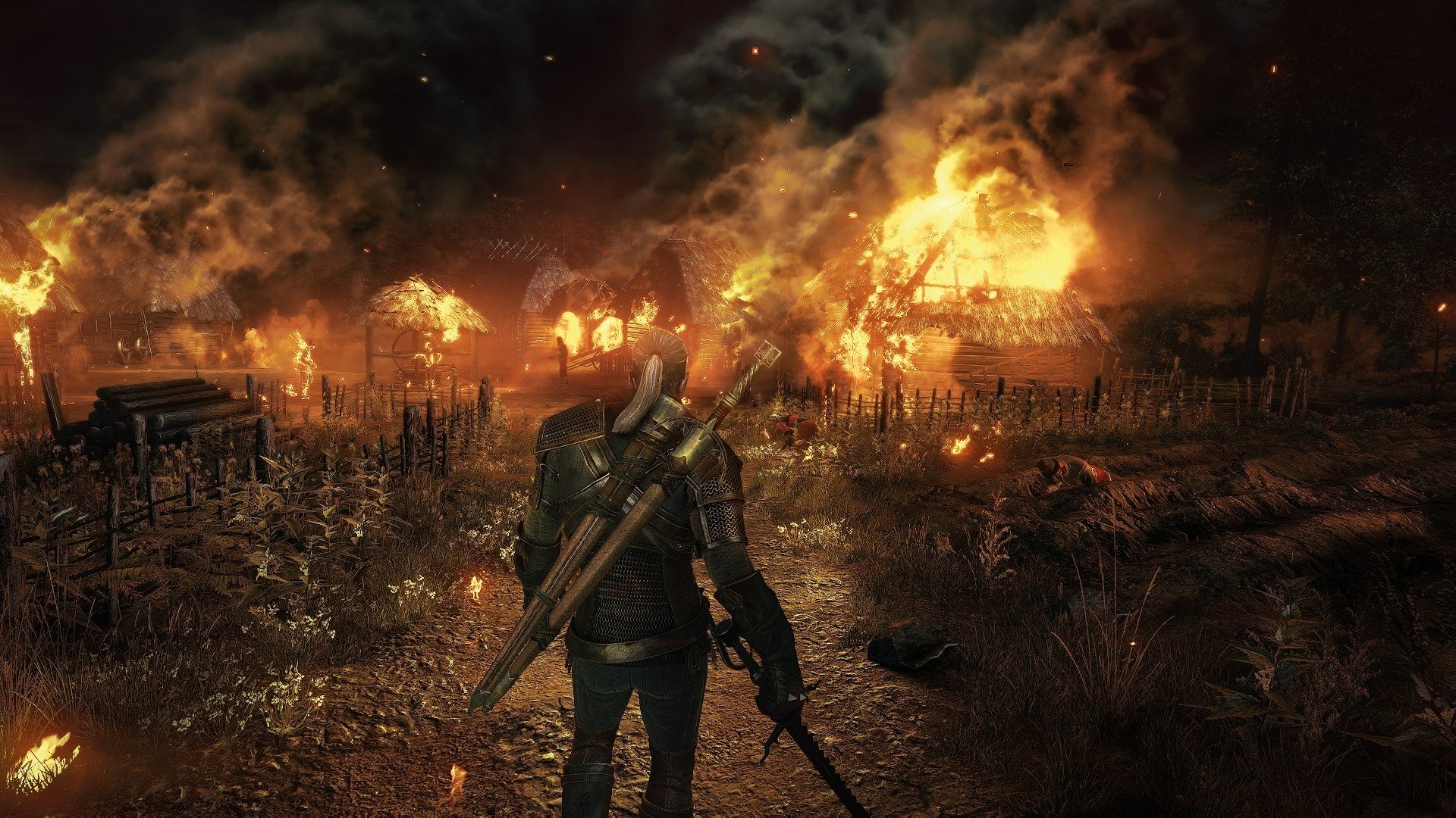 Geralt of Rivia stands watching a village engulfed in flames from The Witcher 3: Wild Hunt, rendered in stunning HD for a PC desktop wallpaper.