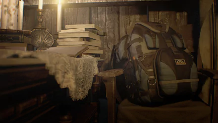 HD PC desktop wallpaper featuring a dimly lit, rustic room with a stacked books, lace cloth, and a worn backpack from the video game Resident Evil 7: Biohazard.