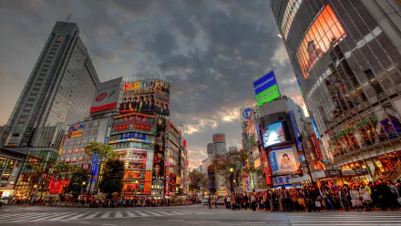 A vibrant Tokyo cityscape at dusk, showcasing bustling crowds and striking man-made architecture, illuminated by colorful advertisements in HDR quality.