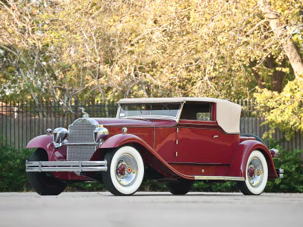 Vintage 1931 Packard Deluxe Eight Convertible Victoria with maroon body and tan soft top, showcased as an HD PC desktop wallpaper and background.