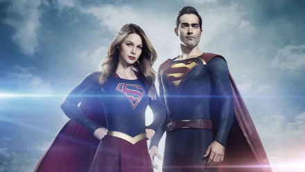 Supergirl and Superman, portrayed by Melissa Benoist and Tyler Hoechlin, stand confidently together in this dynamic HD wallpaper from the TV show Supergirl.