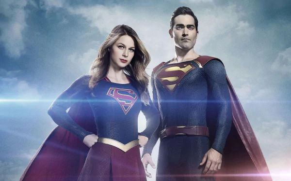 Supergirl and Superman, portrayed by Melissa Benoist and Tyler Hoechlin, stand confidently together in this dynamic HD wallpaper from the TV show Supergirl.