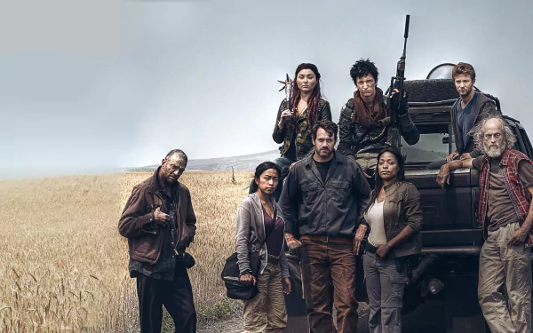 A group of characters from the TV show Z Nation stands confidently in a wheat field, with a vehicle nearby, showcasing their survival spirit in a post-apocalyptic world.