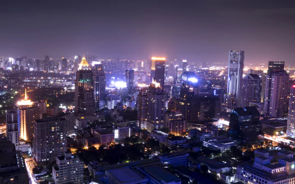 Nighttime 4K Ultra HD cityscape of Johannesburg, South Africa, showcasing illuminated skyscrapers and buildings.