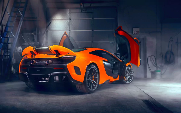 HD PC wallpaper featuring an orange McLaren 650S supercar with its butterfly doors open, set in a dimly lit garage environment.