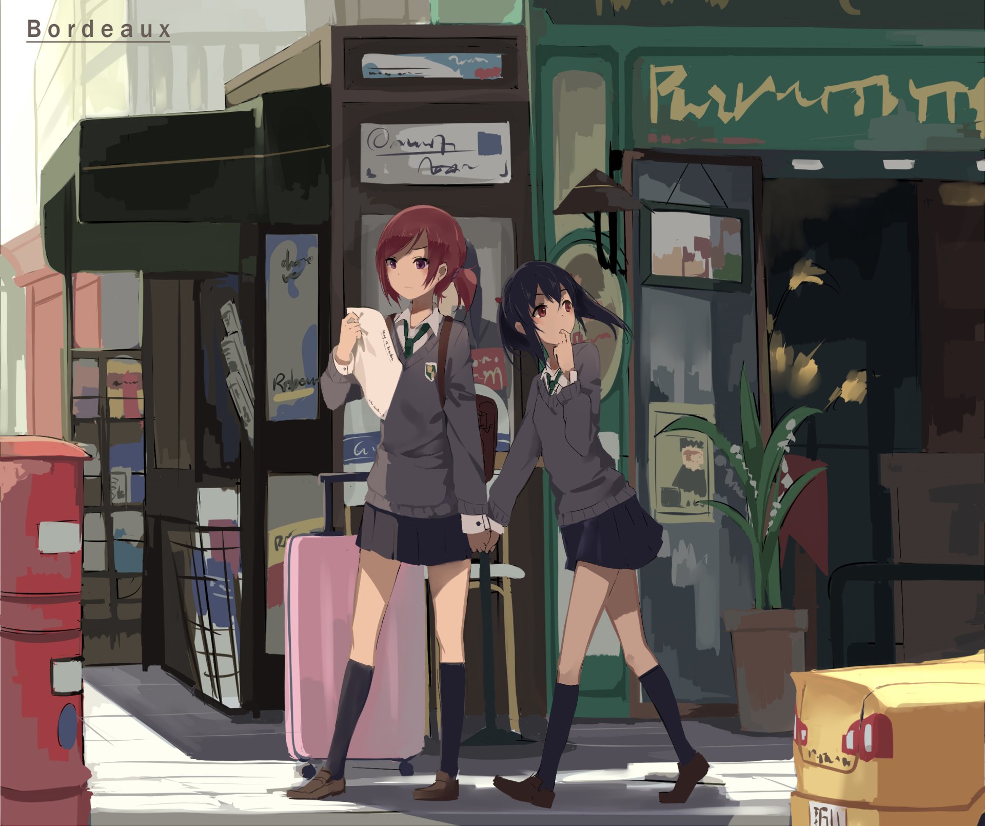 HD anime desktop wallpaper featuring Nico Yazawa and Maki Nishikino from Love Live!, standing in a city street scene with school uniforms and travel luggage.