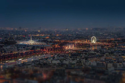 Tilt-shift nighttime cityscape of Paris, France, showcasing illuminated streets and landmarks in stunning 4K Ultra HD detail.