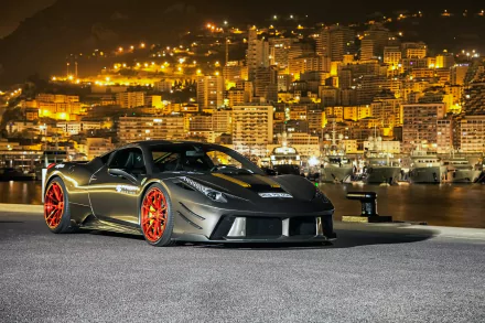 PRIOR-DESIGN Ferrari F458 Italia (Ferrari 458 Italia) with red rims parked by a harbor at night against a glowing city skyline — 2K Quad HD PC desktop wallpaper.