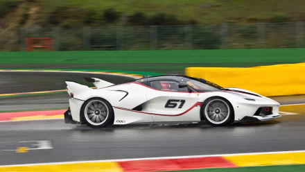 White Ferrari FXX K race vehicle (#61) streaking on a wet track with motion blur — 4K Ultra HD PC desktop wallpaper and background.