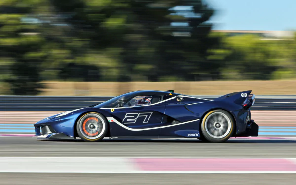 Blue Ferrari FXX K vehicle speeding along a racetrack with motion blur — 4K Ultra HD PC desktop wallpaper and background.