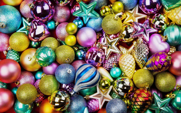 A vibrant collection of colorful Christmas ornaments, including balls and stars, creating a festive holiday scene in 4K Ultra HD quality for desktop wallpaper.