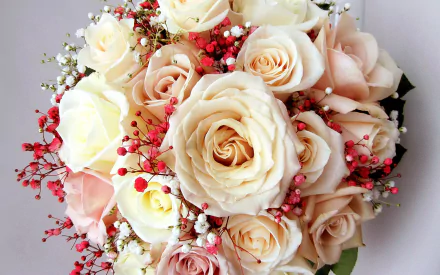 A bouquet of elegant white and soft pink roses, accented with delicate greenery and small red berries, presented as a beautiful HD desktop wallpaper and background.